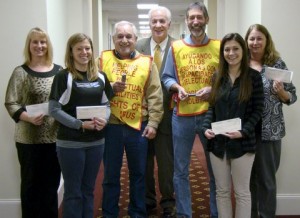 Knights of Columbus present checks to local teachers.